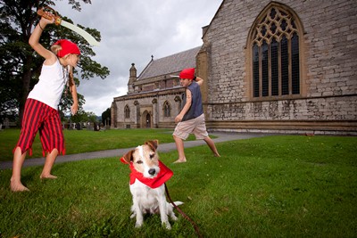 St Asaph Cathedral....North Wales music festival... Pirates at the Cathedral in St Asaph. Pictured are ten year olds Ben and Libby Morgan with Dolly the Dog at St Asaph Cathedral.